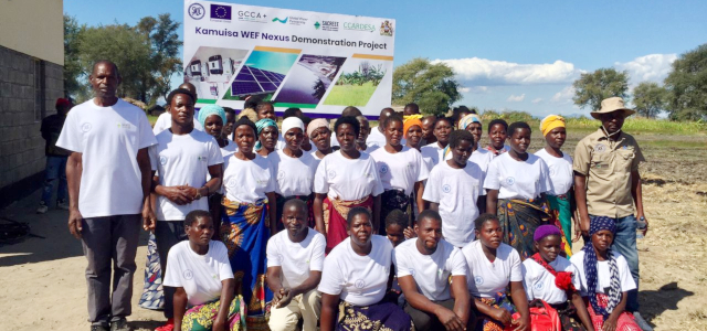 Community beneficiaries of the project pose for a group photo