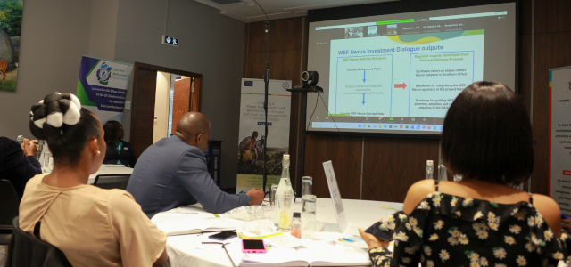 2.	Participants follow a presentation on the WEF Nexus approach during the Eswatini National Dialogue
