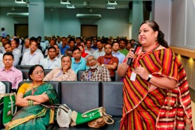 women speaking at event